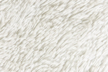 Fluffy plaid of polyester with a long heap gray. Comfortable home textiles. Background, texture