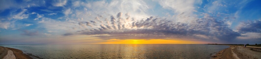 Beautiful summer sunset, view of the sea on sand spit, panorama, banner