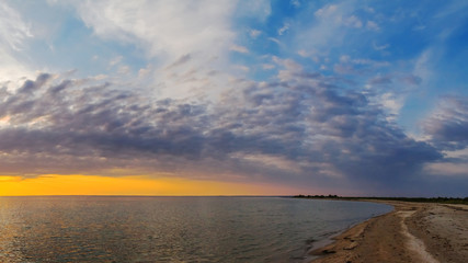 Obraz premium Beautiful summer sunset, view of the sea on sand spit, panorama, banner