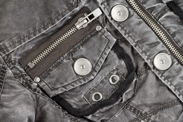 Metal fittings on quilted jacket from tissue, details clothing close-up