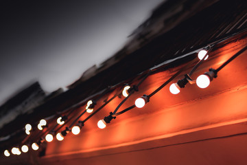 dark orange light bulbs on a dark street