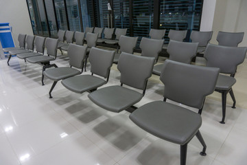 Chair Ppatient many gray in the hospital straight in the corridor.