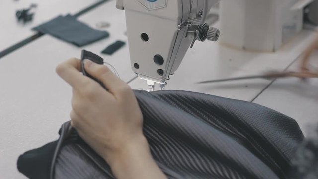 Person stitching close on the hand