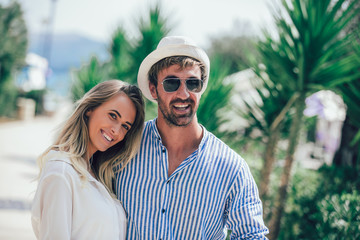 Beautiful couple taking a walk in city park