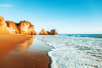 Foto auf Acrylglas Strand Marinha, Algarve, Portugal beautiful ocean landscape, the coast of Portugal, the Algarve, rocks on the sandy beach, a popular destination for travel in Europe
