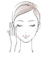 薬指で目元のケアをする女性