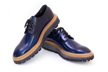 Pair of blue glossy men's shoes isolated on white background
