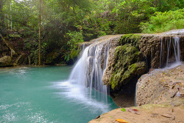 Fototapeta na wymiar Erawan waterfall is a large and beautiful on the banks of Kwai Yai river, it is located in Si sawat District, Kanchanaburi province, Thailand.