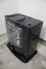 Black kerosene heater in a white background