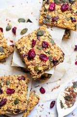 Granola Bars, Superfood Homemade Snack, Healthy Bars with Cranberry, Pumpkin Seed, Oats, Chia and Flax Seed on bright background