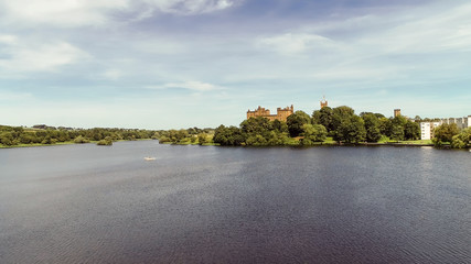 View across the water of Linlithgow Loch towards the Abbey.