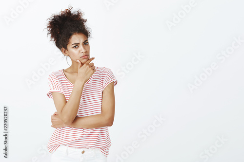 Indoor Shot Of Intense Smart Cute Woman With Dark Skin And