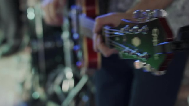 HD Closeup shot form side of a guitarist playing guitar