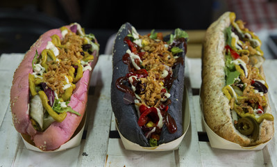 close up on three type of vegan hot dogs
