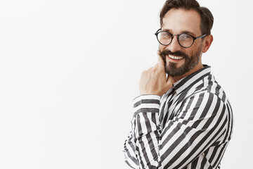 Ready to meet my soulmate. Portrait of charming caucasian happy and flirty guy in striped shirt and...