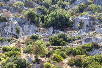 Perspective shoot of historical masonry stone wall ruins belongs to Lycian people at Mediterranean Sea
