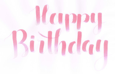 "Happy Birthday" hand lettering in pastel pink color for someone special
