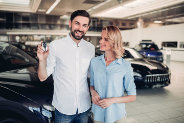 Fototapeta na wymiar couple holding keys of new car