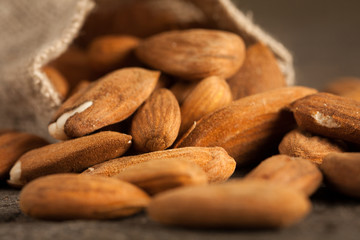 Almonds on wooden background
