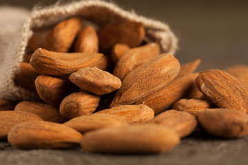 Almonds on wooden background