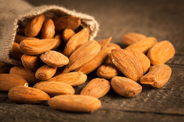 Almonds on wooden background