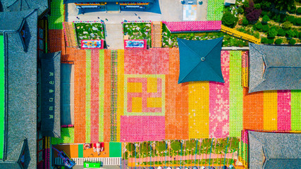 Fototapeta premium Aerial view of Samgwangsa temple in Busan city of South Korea. Thousands of paper lanterns decorate Samgwangsa Temple in Busan, South Korea.
