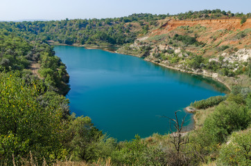 Obraz na płótnie Canvas Lake in a flooded quarry, top view.