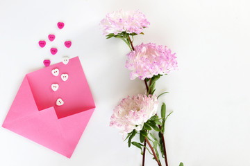 Pink envelope for letters with buttons-hearts and aster on white isolated background