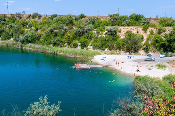 Recreation area in a flooded quarry, top view.