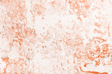 Wall with scuffs, cracks and old orange paint