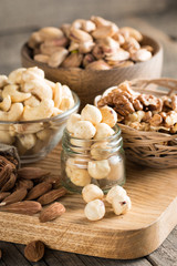 mix of nuts on a wooden table