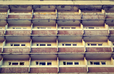 the old building with a balcony view from below