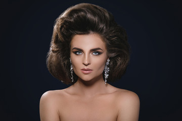 Fototapeta premium Gorgeous woman with a beautiful hairstyle and make-up