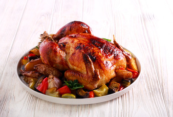 Roast whole chicken with crispy skin and roasted vegetables