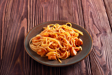 Spaghetti with chicken breast in tomato sauce