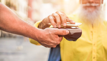 Male customer paying with contactless smartphone with web app
