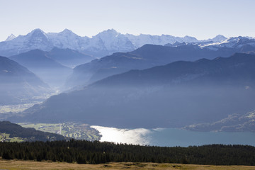 Plakat Alps in Switzerland with Eiger, Moench, Jungfrau and Lake Thun on a nice autumn day