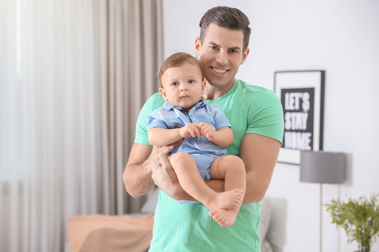 Father with his cute little son at home
