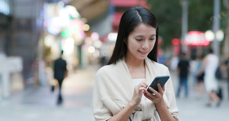 Fototapeta premium Woman use of mobile phone phone online