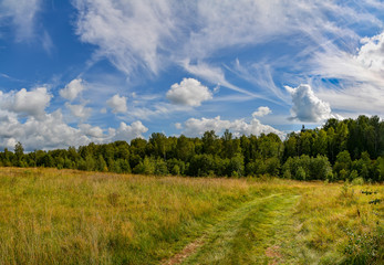 Landscape with clouds in the summer sky. The last days of August.