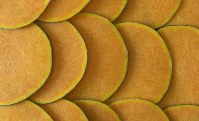 pumpkin slices cut thin and overlapping of intense orange color