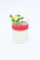 White Dessert with strawberry jam amd mint on isolated white background.