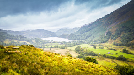 Landscape of Snowdonia  National Park with a view on Gwynant lake on a rainy and foggy day in Wales, UK