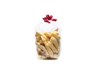 Nut Meringue in translucent plastic bag on white background isolated