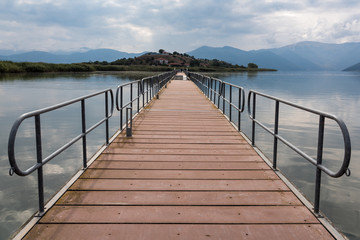 Obraz premium View of the floating bridge in the Mikri (Small) Prespa Lake in northern Greece