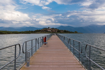 Fototapeta na wymiar View of the floating bridge in the Mikri (Small) Prespa Lake in northern Greece
