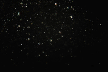 glitter black and silver lights background. de-focused.