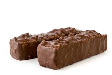 Waffles with nuts drenched with chocolate close-up on a white, isolated.