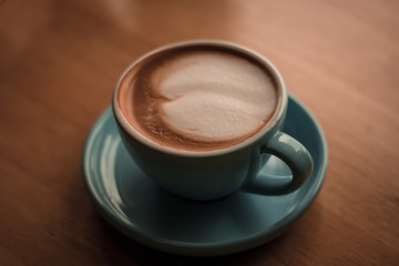 Hot Latte on the wooden table