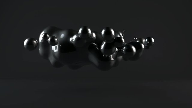 3D animation of drops that disintegrate and merge in zero gravity.
